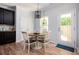 Bright breakfast nook featuring a modern chandelier and outdoor access at 319 Nobleman Way, Canton, GA 30114