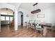 Charming dining room with modern chandelier, seating for six, and hardwood flooring at 319 Nobleman Way, Canton, GA 30114