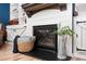 Cozy fireplace with white mantel, decorative accents, and rustic charm at 319 Nobleman Way, Canton, GA 30114