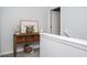 Decorated hallway with accent table and stylish decor, offering a welcoming transition at 319 Nobleman Way, Canton, GA 30114