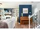 Inviting living room with a fireplace and piano next to an open staircase at 319 Nobleman Way, Canton, GA 30114