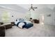 Spacious main bedroom featuring a tray ceiling, fan, and an ensuite bathroom at 319 Nobleman Way, Canton, GA 30114