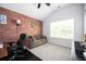 Bright office with a brick wall, comfortable seating, and large window at 319 Nobleman Way, Canton, GA 30114