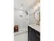 Bathroom featuring a modern shower, sleek vanity, stylish fixtures, and a refreshing design at 3445 Strawberry Ln, Cumming, GA 30041