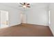 Large bedroom with a ceiling fan, natural light, and neutral carpet at 3445 Strawberry Ln, Cumming, GA 30041