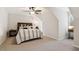 Bright bedroom featuring hardwood floors, a ceiling fan, and comfortable seating at 3445 Strawberry Ln, Cumming, GA 30041