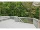 Exterior shot of the wood deck surrounded by green foliage at 3445 Strawberry Ln, Cumming, GA 30041
