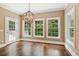 Dining room with hardwood floors, chandelier, large windows and access to the outdoor patio at 3445 Strawberry Ln, Cumming, GA 30041