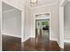 Hallway with hardwood floors offering views into other rooms at 3445 Strawberry Ln, Cumming, GA 30041