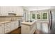 Bright kitchen with granite countertops and island at 3445 Strawberry Ln, Cumming, GA 30041