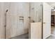 Modern bathroom featuring a glass-enclosed shower with multiple showerheads and a built-in shelf at 3445 Strawberry Ln, Cumming, GA 30041