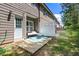 Back patio with outdoor furniture and white fence at 7805 Rock Rose Ln, Fairburn, GA 30213
