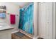 Full bathroom featuring shower with curtain and closet at 7805 Rock Rose Ln, Fairburn, GA 30213
