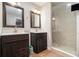 Main bathroom with double vanity and glass shower at 7805 Rock Rose Ln, Fairburn, GA 30213
