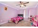 bedroom with a pink and purple theme at 7805 Rock Rose Ln, Fairburn, GA 30213