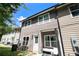 Exterior view of a townhome showing the backyard patio, siding, and AC unit at 7805 Rock Rose Ln, Fairburn, GA 30213