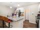 Well-lit kitchen featuring stainless steel appliances, granite countertops, and functional island at 7805 Rock Rose Ln, Fairburn, GA 30213