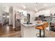 Stylish kitchen featuring stainless steel appliances, granite countertops, and a convenient breakfast bar at 7805 Rock Rose Ln, Fairburn, GA 30213