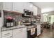 Modern kitchen with stainless steel appliances, granite countertops, and ample cabinet space at 7805 Rock Rose Ln, Fairburn, GA 30213