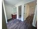 Bathroom featuring new flooring, a sink with a vanity, a mirror, and a walk-in closet at 1857 Oak Hill Springs Blvd, Lithonia, GA 30058
