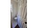 Half bathroom with a toilet, small window and white tile floors at 1857 Oak Hill Springs Blvd, Lithonia, GA 30058