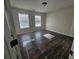 Bedroom featuring natural light, wood-look floors, and an exterior view from the windows at 1857 Oak Hill Springs Blvd, Lithonia, GA 30058