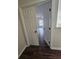 View of a bedroom with dark wood floors and natural light, showcasing the house's interior design at 1857 Oak Hill Springs Blvd, Lithonia, GA 30058