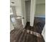 Spacious bedroom featuring a closet with built-in shelving and warm wood flooring at 1857 Oak Hill Springs Blvd, Lithonia, GA 30058
