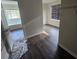 Bedroom featuring new flooring, window with blinds, and walk-in closet at 1857 Oak Hill Springs Blvd, Lithonia, GA 30058
