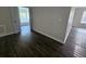 Bedroom featuring new flooring and doorway to the bathroom at 1857 Oak Hill Springs Blvd, Lithonia, GA 30058
