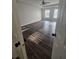 Spacious bedroom featuring dark wood floors, a ceiling fan, and two windows for ample natural light at 1857 Oak Hill Springs Blvd, Lithonia, GA 30058