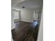Bedroom featuring new flooring, overhead light, and open doorway to bathroom at 1857 Oak Hill Springs Blvd, Lithonia, GA 30058