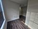 Walk-in closet with modern vinyl floors, shelving, and neutral paint at 1857 Oak Hill Springs Blvd, Lithonia, GA 30058