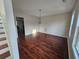 Elegant dining area featuring hardwood floors, a chandelier, and ample natural light at 1857 Oak Hill Springs Blvd, Lithonia, GA 30058