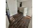 Hallway features wood-look floors, neutral paint, and classic white trim at 1857 Oak Hill Springs Blvd, Lithonia, GA 30058