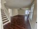 Inviting living room with hardwood floors, a fireplace, and staircase at 1857 Oak Hill Springs Blvd, Lithonia, GA 30058
