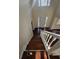 Staircase featuring white railings and banisters leading to a spacious landing and front entryway at 1857 Oak Hill Springs Blvd, Lithonia, GA 30058