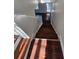 Hardwood staircase featuring white trim leading to the upper level at 1857 Oak Hill Springs Blvd, Lithonia, GA 30058