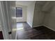 Walk-in closet featuring new flooring, window with blinds, and shelving at 1857 Oak Hill Springs Blvd, Lithonia, GA 30058