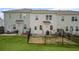Aerial view of backyards in a townhome community with black metal fencing and grass at 1914 Carovel Way, Kennesaw, GA 30144