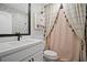 Charming bathroom featuring a decorative shower curtain, modern vanity, and elegant decor at 1914 Carovel Way, Kennesaw, GA 30144