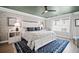 Spacious bedroom featuring a king-size bed, decorative wallpaper, and ample natural light at 1914 Carovel Way, Kennesaw, GA 30144