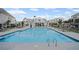 Wide view of a crystal clear community pool area and common areas with outdoor furniture at 1914 Carovel Way, Kennesaw, GA 30144
