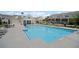 View of the community pool with lounge chairs and a clubhouse in a neighborhood setting at 1914 Carovel Way, Kennesaw, GA 30144