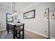 The dining area features modern lighting, a table with stools, and views of the backyard at 1914 Carovel Way, Kennesaw, GA 30144