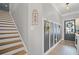 Open entryway with staircase, decorative wall hangings, and access to the front door at 1914 Carovel Way, Kennesaw, GA 30144