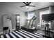 Home gym with treadmill, stationary bike, and full-length mirror at 1914 Carovel Way, Kennesaw, GA 30144
