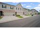 Neighborhood street view showcasing townhome exteriors and attached garages at 1914 Carovel Way, Kennesaw, GA 30144