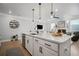 Bright kitchen features white cabinetry, stainless steel appliances, and open floor plan at 1914 Carovel Way, Kennesaw, GA 30144