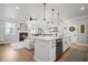 Open floor plan with a bright kitchen and living room with a fireplace at 1914 Carovel Way, Kennesaw, GA 30144